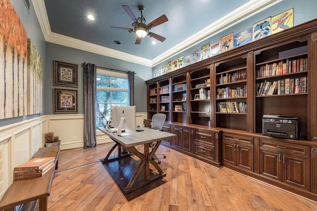 Built-in library shelving with desk and cabinetry