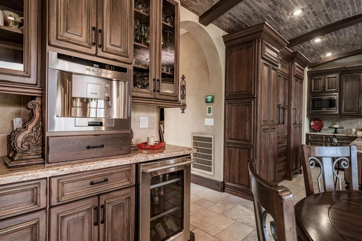 Stained kitchen cabinetry with built-in coffee station