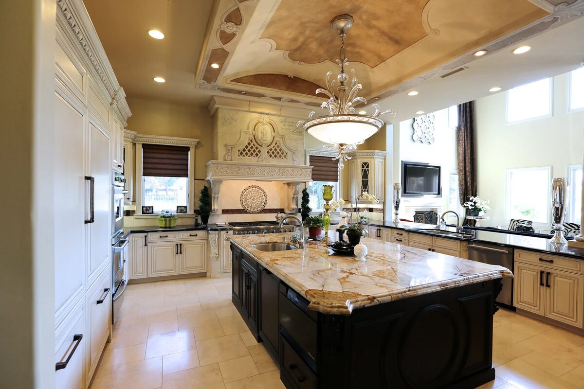 Large kitchen with detailed ceiling and granite island