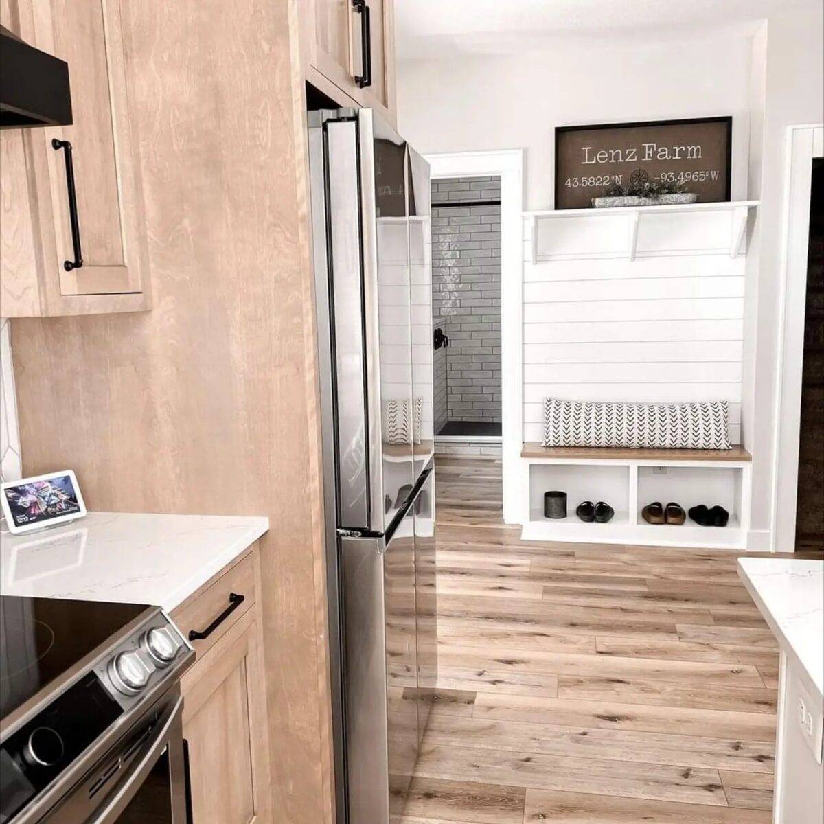 White kitchen with walk-in pantry and hardwood floors