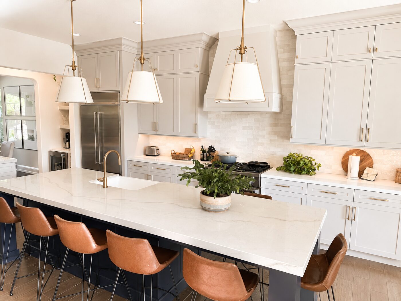 Painted kitchen island with leather counter stools