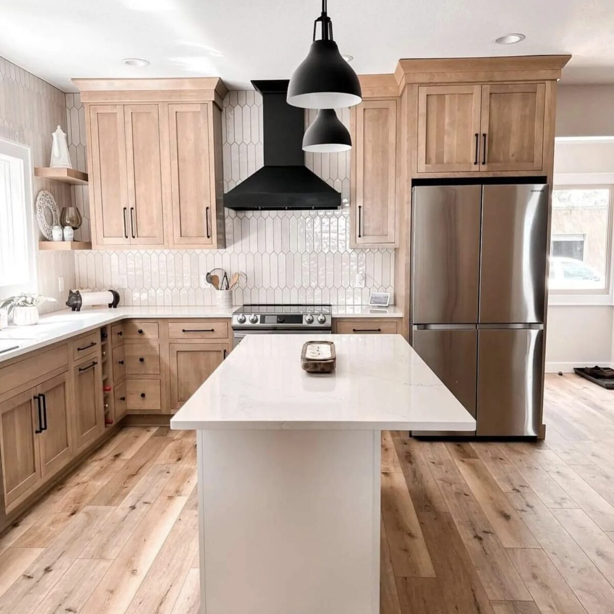 Two-tone kitchen with wood uppers and painted base cabinets