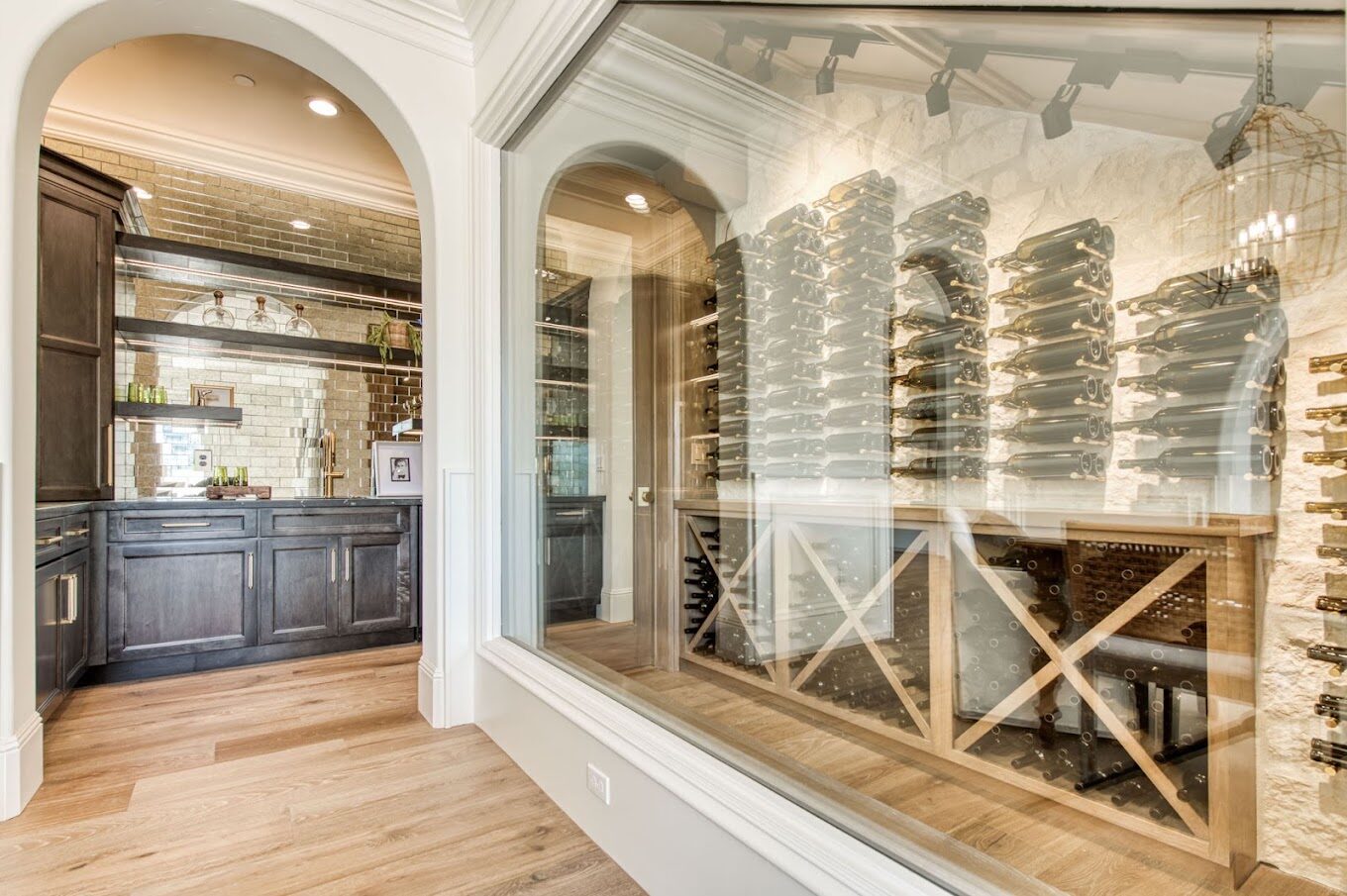 Glass-walled wine cellar with custom racking
